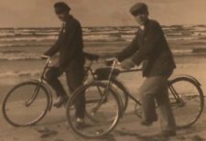 Real Photo Postcard RPPC ~ Two Men On Bicycles ~ Ocean & Beach Backdrop  Review
