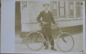 1910 Realphoto Postcard: Man with Bicycle – Chocolat Menier Advertising Sign Review